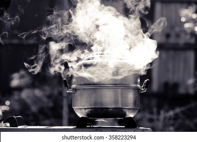 Steam Over Cooking Pot In Kitchen 