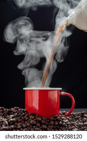 The Steam From Pouring Coffee In Red Cup  