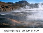 Steam rising from geothermal pools, Geyser Blanco, San Pedro De Atacama, Chile