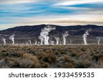 Steam rising from geothermal vents in the Nevada desert	