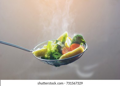 The Steam From The Vegetable Colander In The Dark,hot Food And Healthy Meal Concept