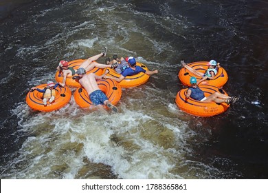 Steamboat Springs, Colorado - July 4, 2020: Group Of People Tubing Down The Yampa River