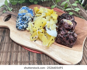 Steamed black sticky rice banana dumpling and steamed blue sticky rice dumpling with Wild yam - Powered by Shutterstock