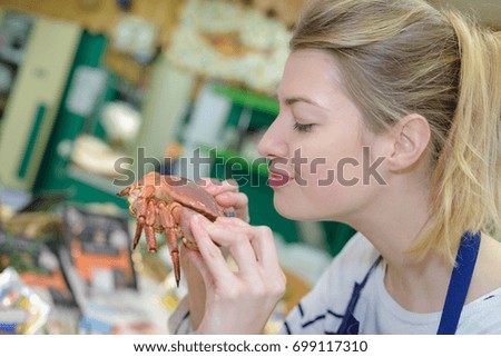 steamed blue swimming crabs on woman hands