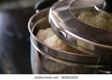 Steamed Cauliflower In Steamer Pot. Healthy Eating And Vegetable Concepts.