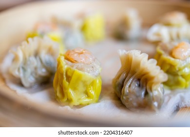 Steamed chinese dim sum with Shumai and meat dumpling - Shutterstock ID 2204316407