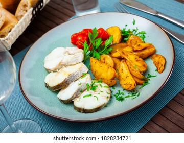 Steamed Cornish Salmon Steaks Served With Fried Potato Wedges, Pickled Tomatoes And Greens