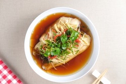 Steamed Dory Fillet Fish With Spicy Soy Sauce And Ginger Served On White Plate. Chinese Food Style.
