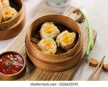 Steamed dumpling dimsum in traditional bamboo steamer - Powered by Shutterstock