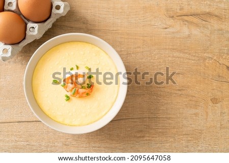 Steamed egg with shrimp and spring onions on top