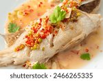 Steamed grouper fish with lime and chillies - Asian food style