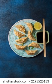 Steamed Gyoza Or Dumpling Stuffed Fish Top View, Chinese Food On Plate Dark Surface