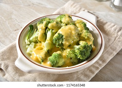 Steamed Organic Broccoli With Gourmet Cheddar Cheese Sauce.