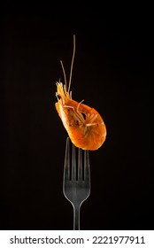 Steamed  Shrimp Steam On Fork Isolated Black Background Copy Space. Isolated Black Background Backlight  Backlit Food Concept Ready To Eat