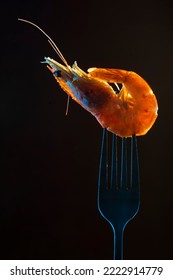 Steamed  Shrimp Steam On Fork Isolated Black Background Copy Space. Isolated Black Background Backlight  Backlit Food Concept Ready To Eat