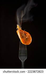 Steamed  Shrimp Steam On Fork Isolated Black Background Copy Space. Isolated Black Background Backlight  Backlit Food Concept Ready To Eat