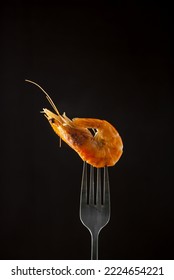 Steamed  Shrimp Steam On Fork Isolated Black Background Copy Space. Isolated Black Background Backlight  Backlit Food Concept Ready To Eat