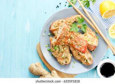 Steamed Snapper (pacific Ocean Perch, Sea Bass, Ruby Perch) With Soy Sauce, Lemon, Ginger And Parsley In Asian Style. Healthy Cooking