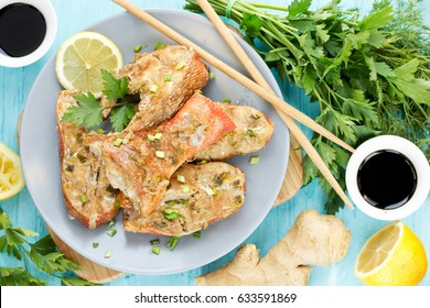 Steamed Snapper (pacific Ocean Perch, Sea Bass, Ruby Perch) With Soy Sauce, Lemon, Ginger And Parsley In Asian Style. Healthy Cooking