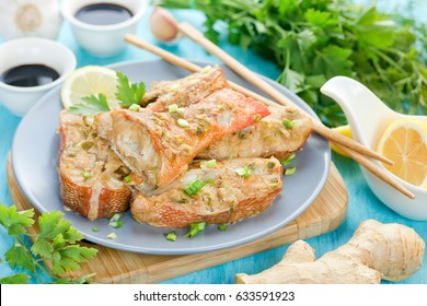 Steamed Snapper (pacific Ocean Perch, Sea Bass, Ruby Perch) With Soy Sauce, Lemon, Ginger And Parsley In Asian Style. Healthy Cooking