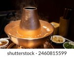 Steaming Beijing copper pot hotpot, photographed in Beijing, China