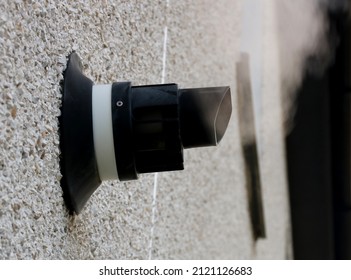 Steaming Central Heating Boiler Vent On An External House Wall