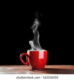 Steaming Coffee Cup On Dark Background