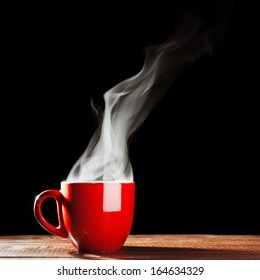 Steaming Coffee Cup On Dark Background