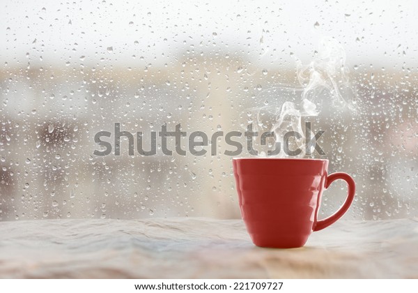 Steaming Coffee Cup On Rainy Day Stock Photo Edit Now