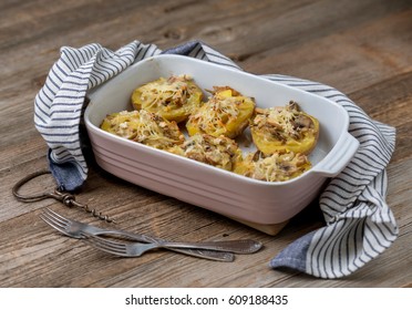 Steaming Hot Dish Of Baked Stuffed Potatoes With Mushrooms And Cheese, Blue Lovely Towel