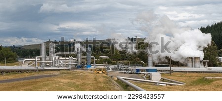 Steaming  pipeline of geothermal power plant panorama, green energy