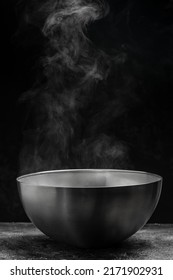 Steaming Pot On Black Background, Hot Food Concept. Bowl Of Hot Steam Of Hot Soup With Smoke,