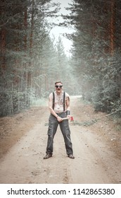 Steampunk Man In Glasses With Ax In Forest Outdoor