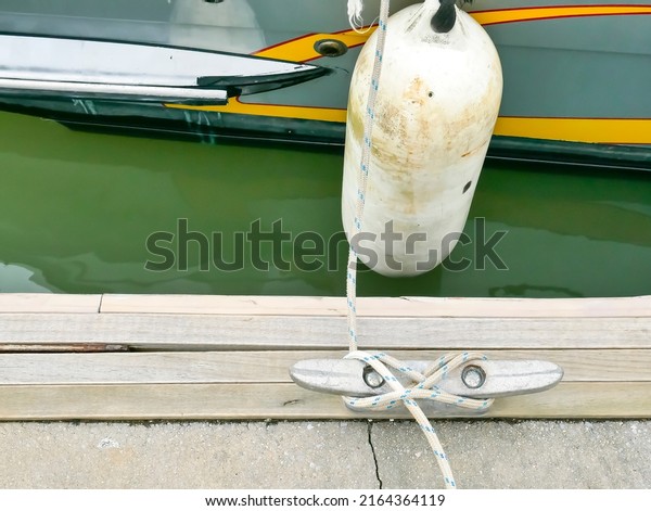 a steel anchor with a\
rope