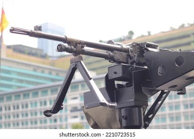 Steel Anti Tank Gun With Office Building Background.