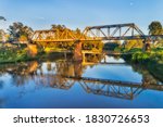 Steel archs of historic railway bridge in Dubbo town of Great Western plains in Australia on Macquarie river.