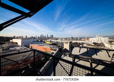 Steel balcony from old building looking over Los Angeles downtown under blue sky - Shutterstock ID 776719204