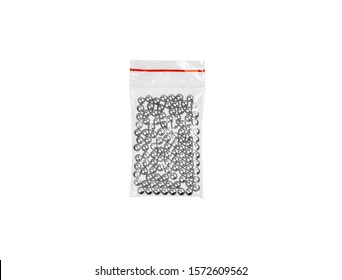 Steel balls in a plastic bag isolate on a white background. Balls for airguns.