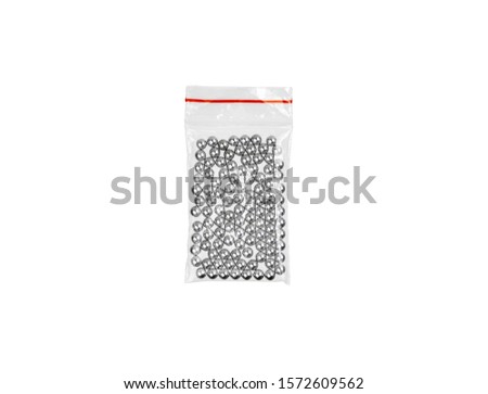 Steel balls in a plastic bag isolate on a white background. Balls for airguns.