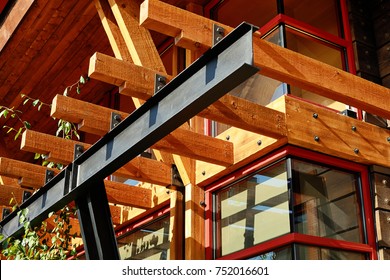 Steel I beam with exposed wood joists.