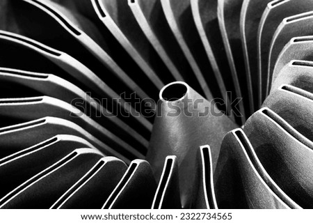 Steel blades of turbine propeller 3D printing. Close-up view. Selected focus on foreground, industrial additive technologies concept