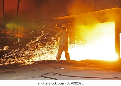 Steel blast furnace taphole spewed molten iron - Powered by Shutterstock