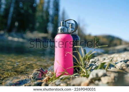 steel bottle on the beach of river 