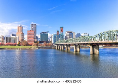 steel bridge over water with cityscape and skyline in portland
