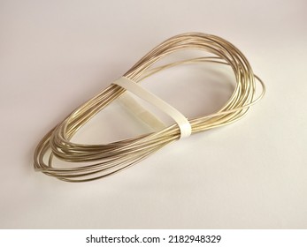 Steel Cable In A Nylon Sheath On A White Background.