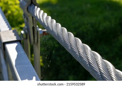 Steel Cable On The Suspension Bridge Railing.