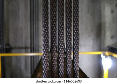 Steel cable sling for passenger lift, inside elevator shaft, blur background
