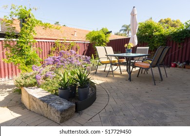 Steel Chairs And Table On Stone Floor Garden Terrace