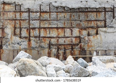Steel corrosion in reinforced concrete.Reinforced concrete with damaged and rusty steel bar in marine and chloride environments.Degraded concrete and corrosion of reinforcement bars:Concrete cancer