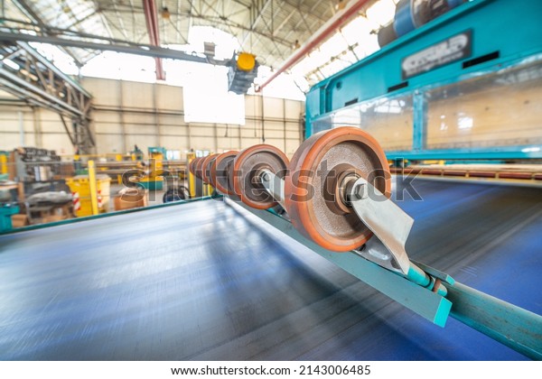 Steel Cutting Machine. Industrial\
machine for metel sheet coils cut, business\
concept.